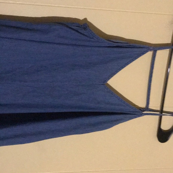 A denim dress with a design on the bottom - Picture 3 of 4